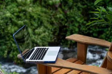 laptop on chair outdoors